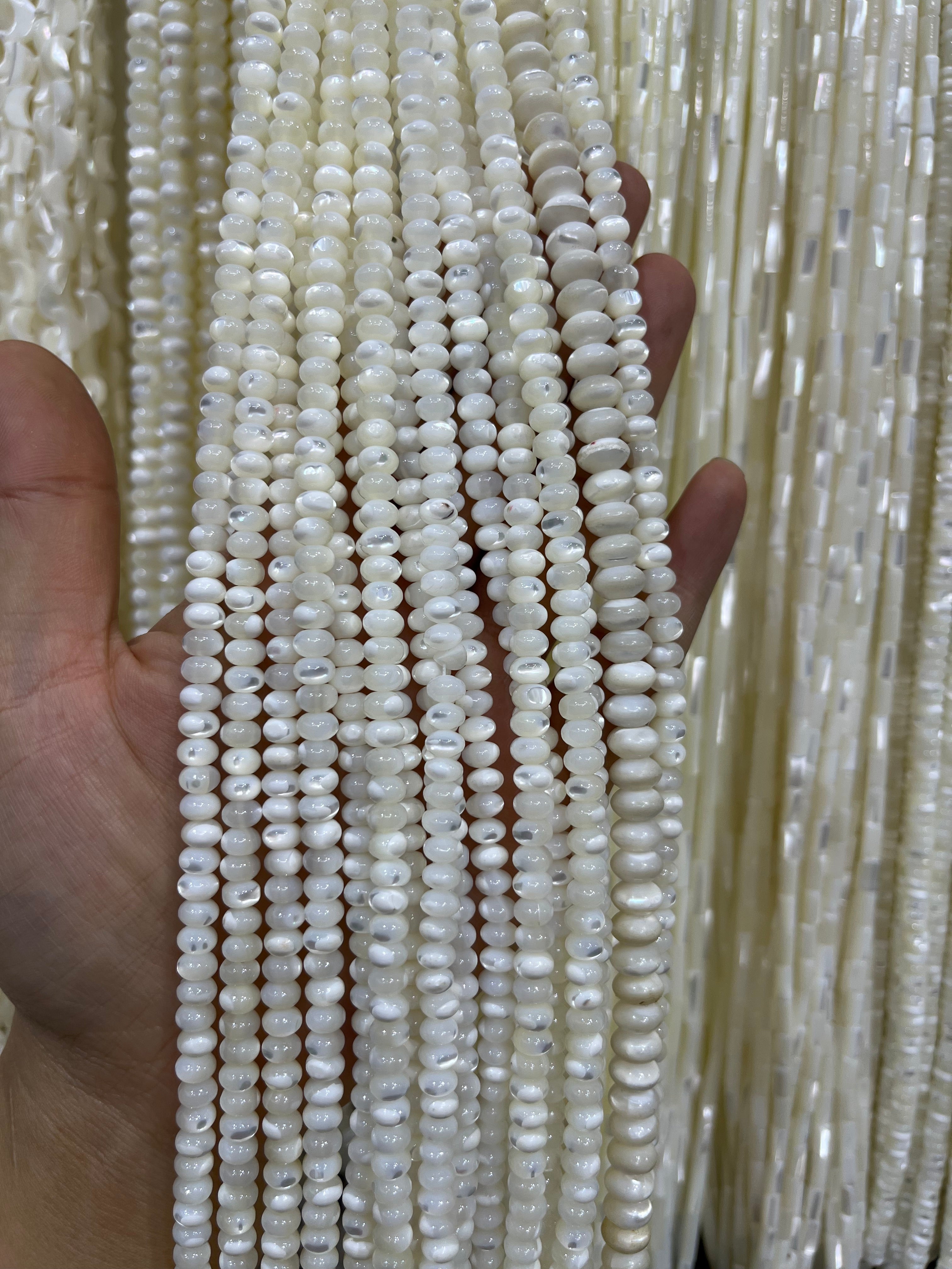 white shell donut beads strand