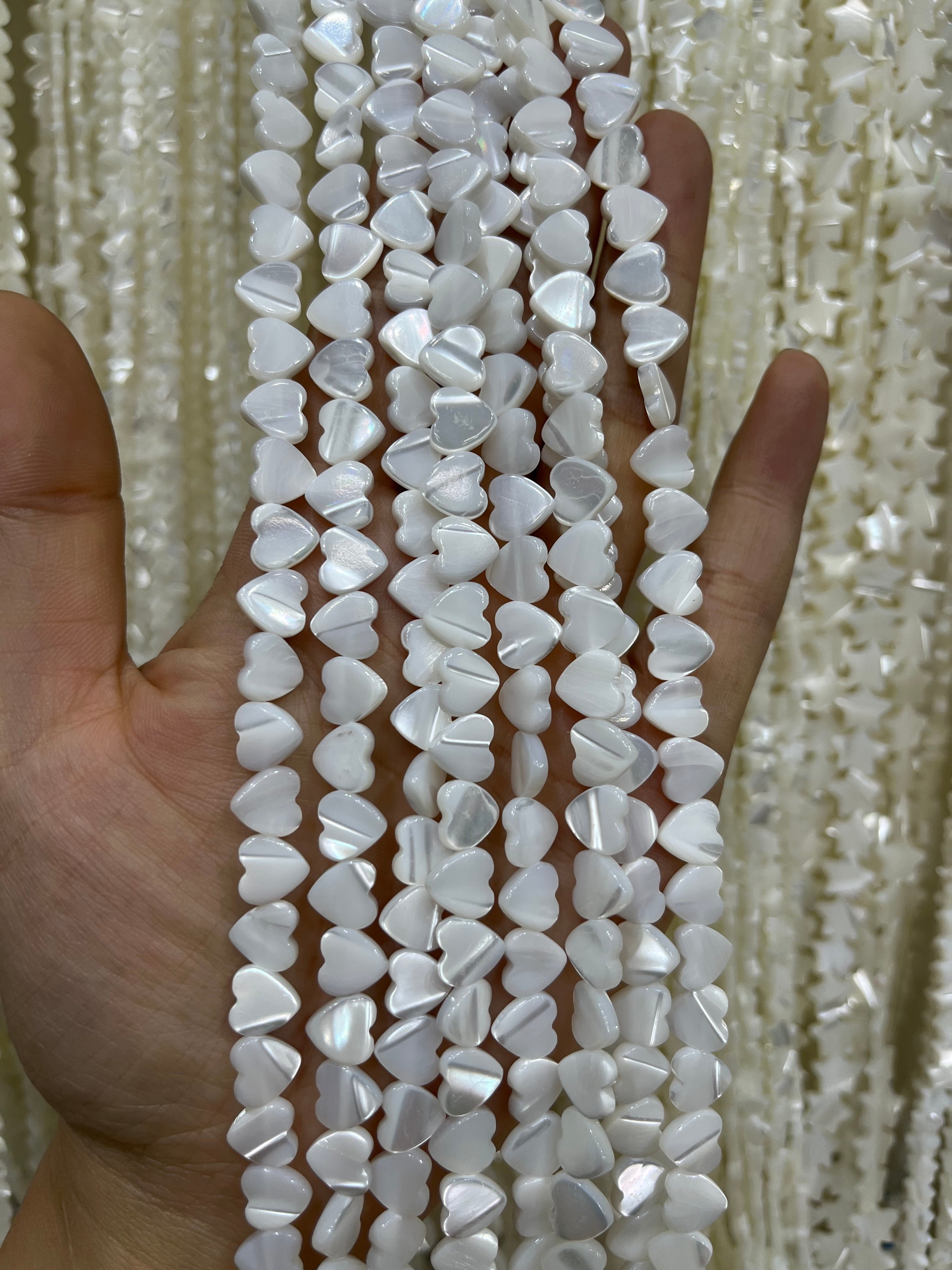 white shell heart beads strand