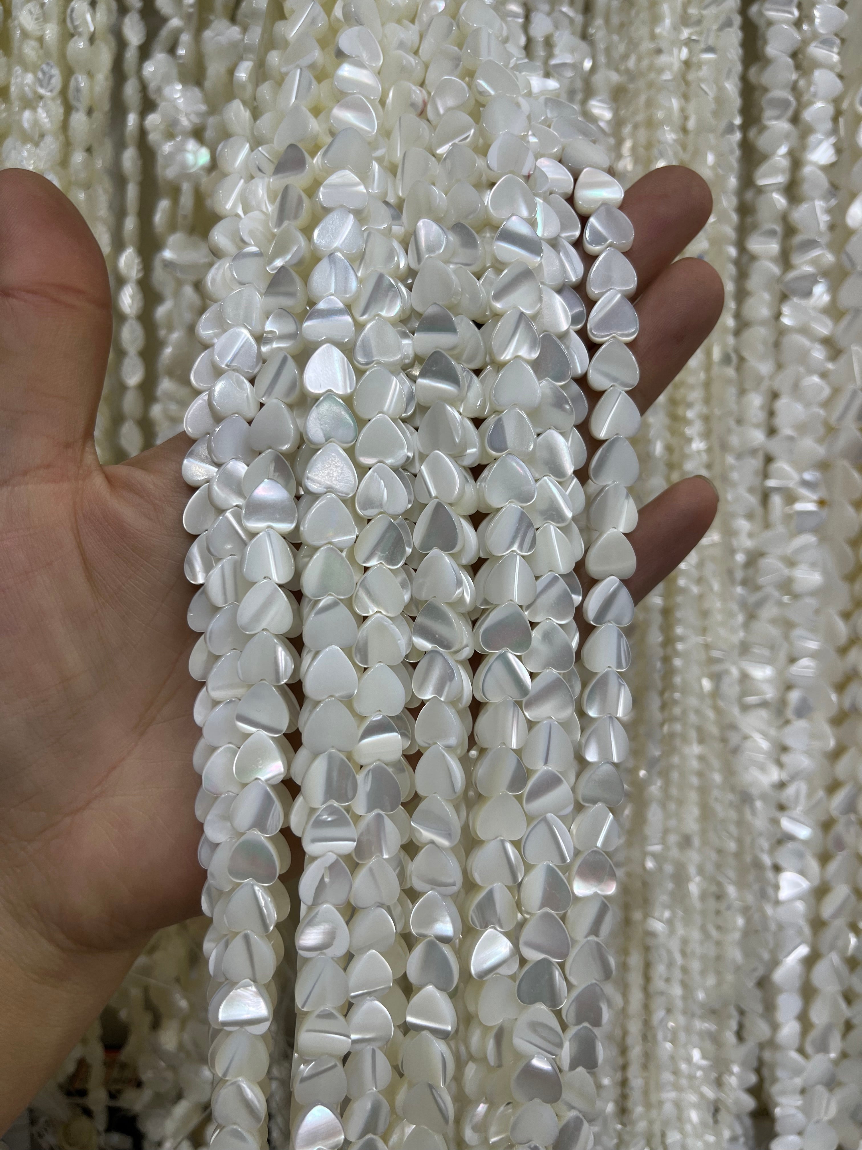 white shell heart beads strand