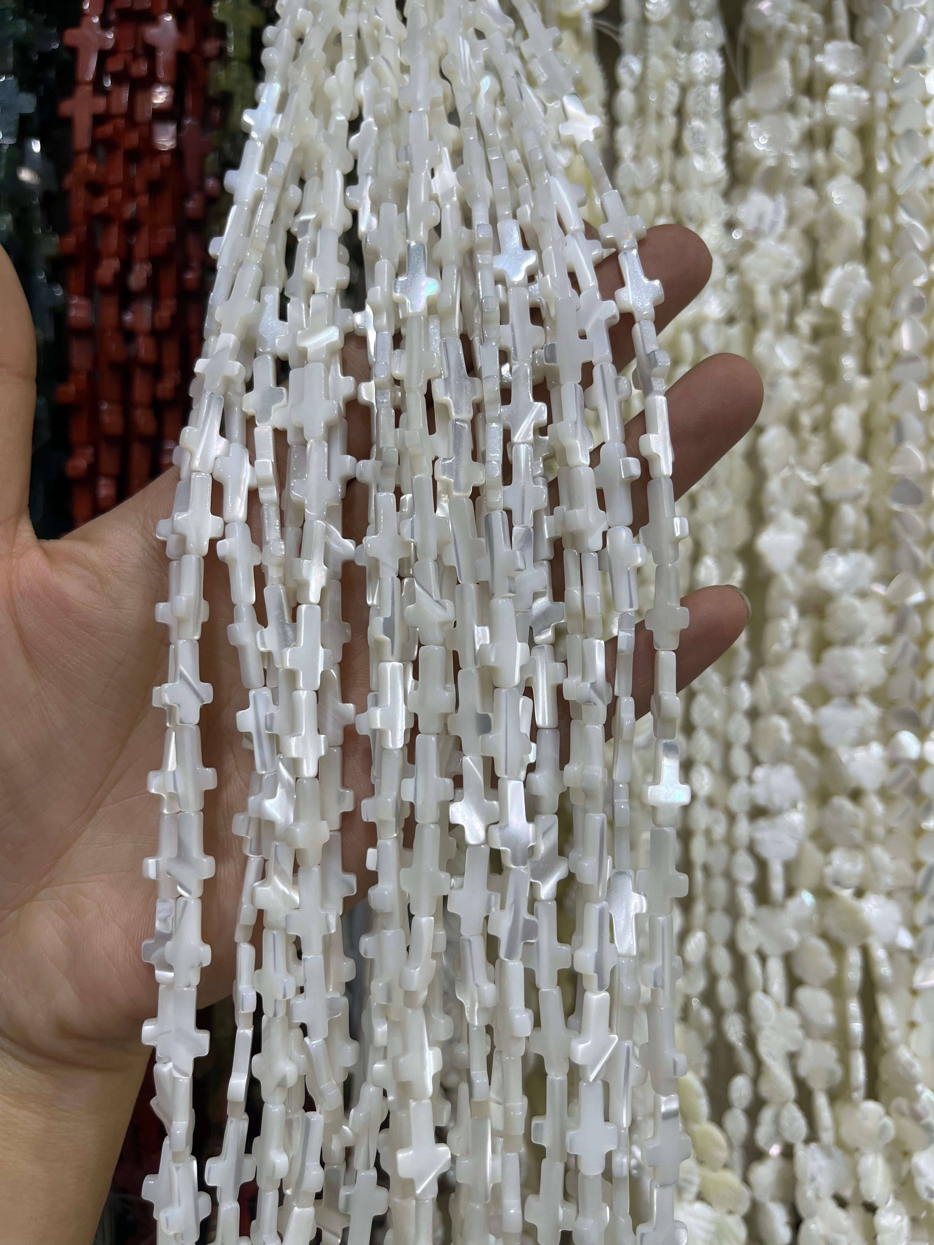 white shell cross beads strand