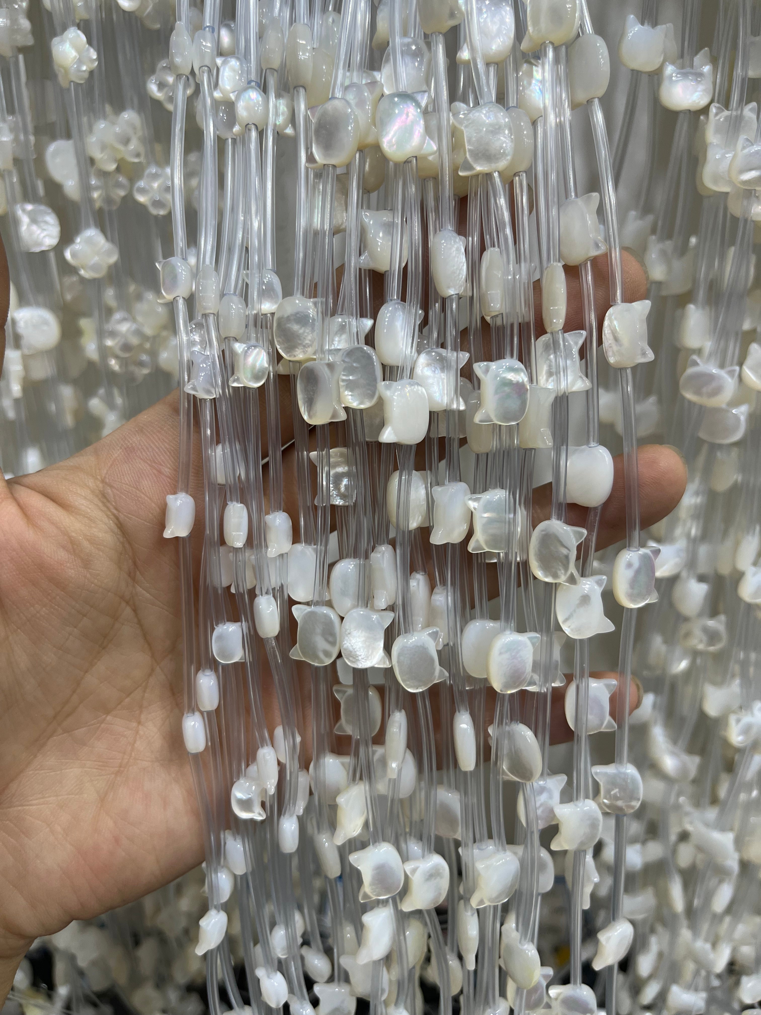 white shell cat head beads strand