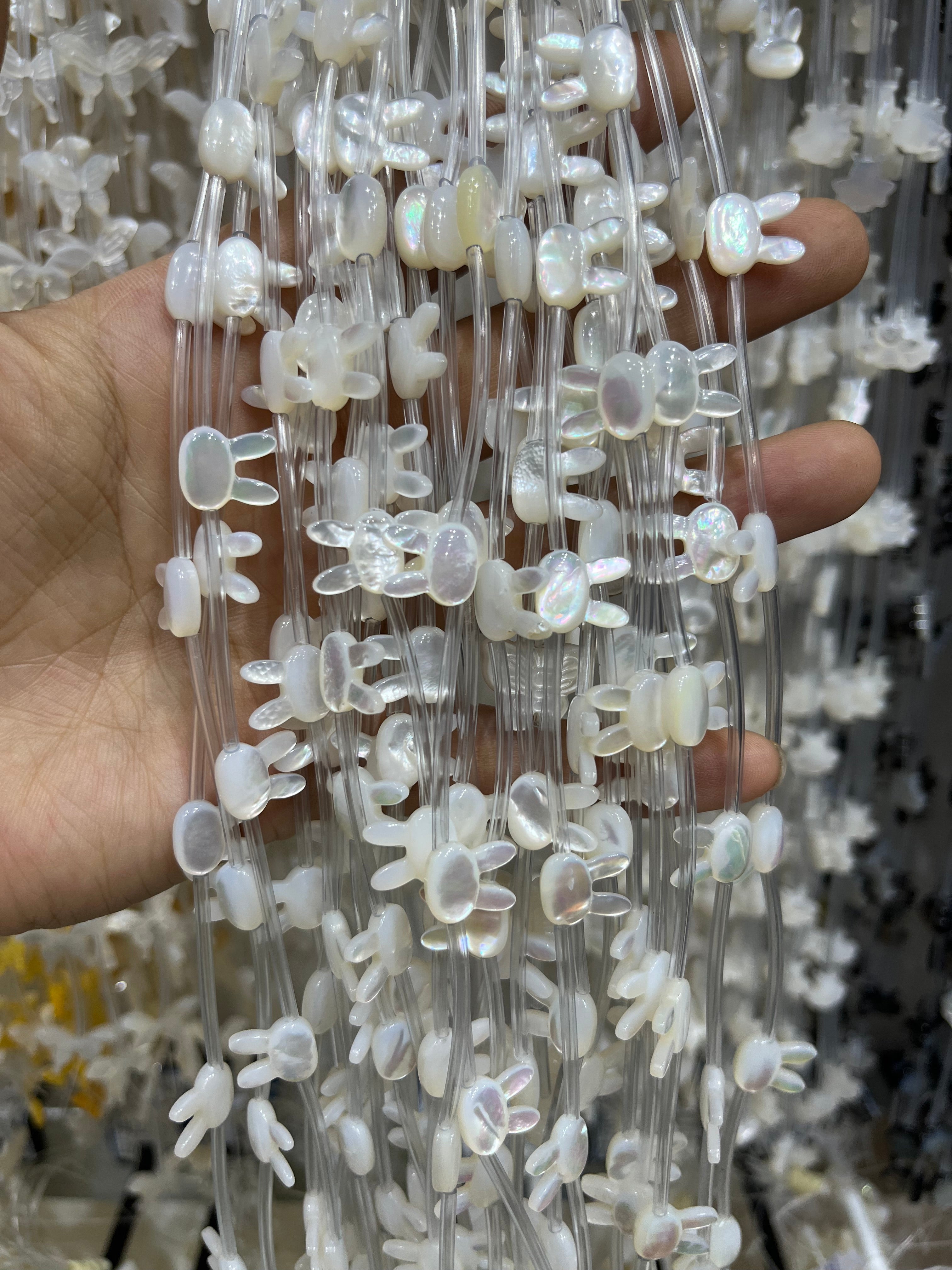 white shell buny beads strand