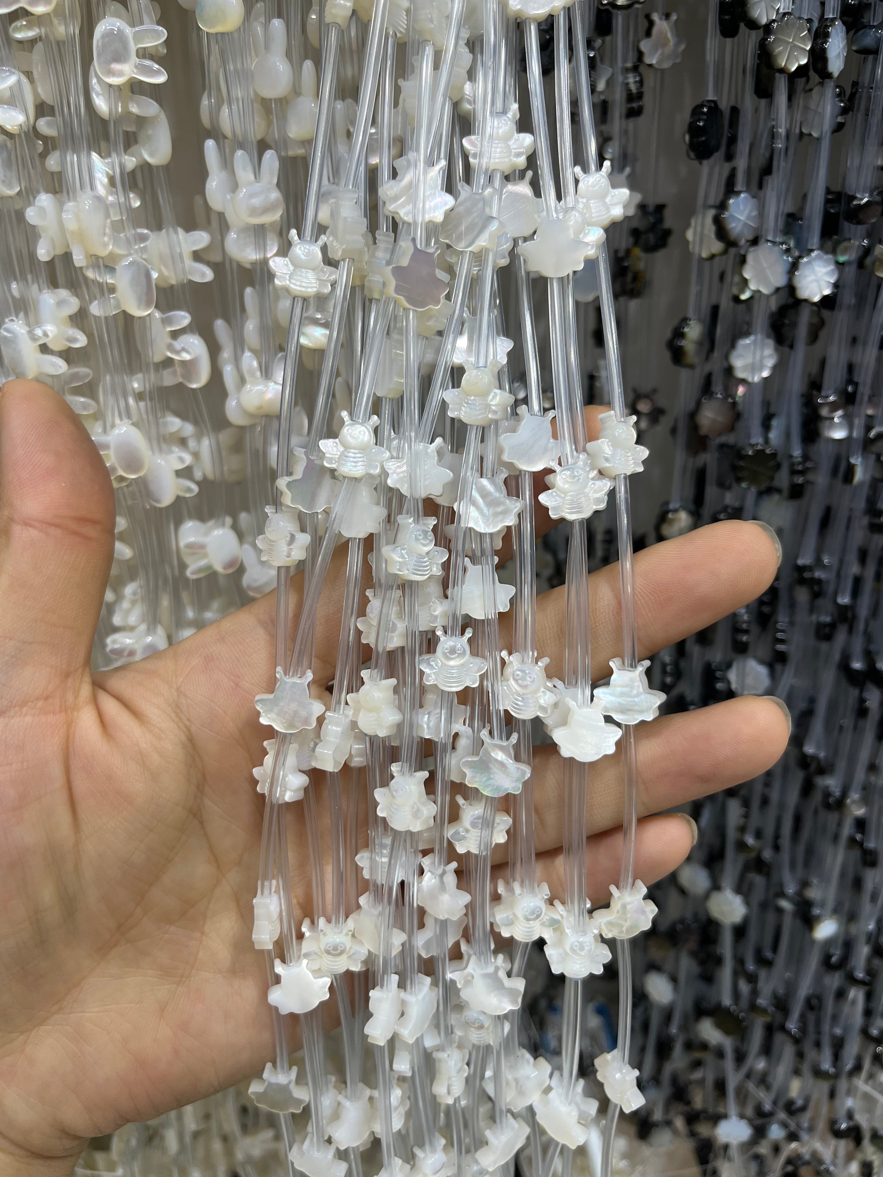 white shell bee beads strand