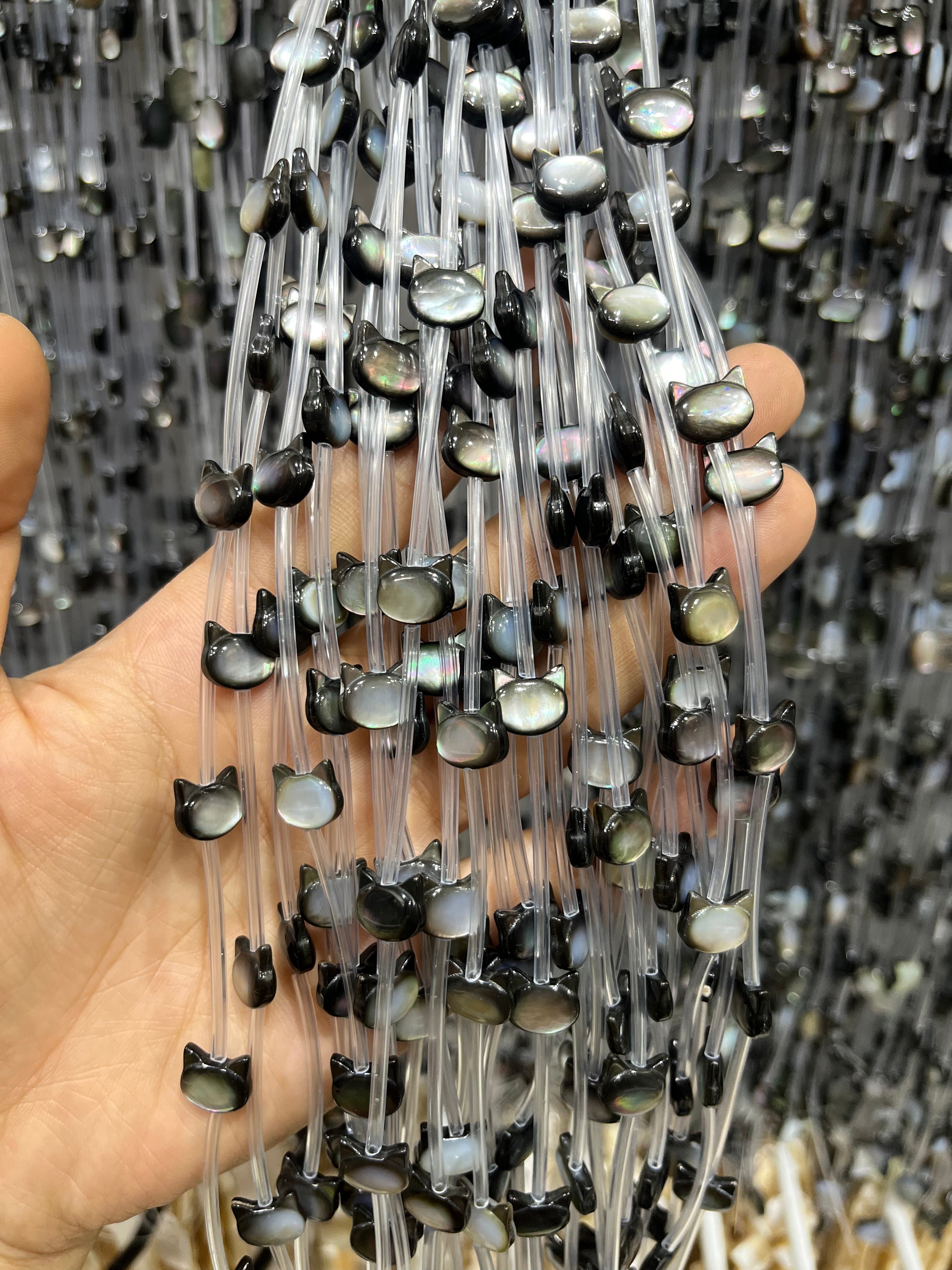 black shell cat head beads strand